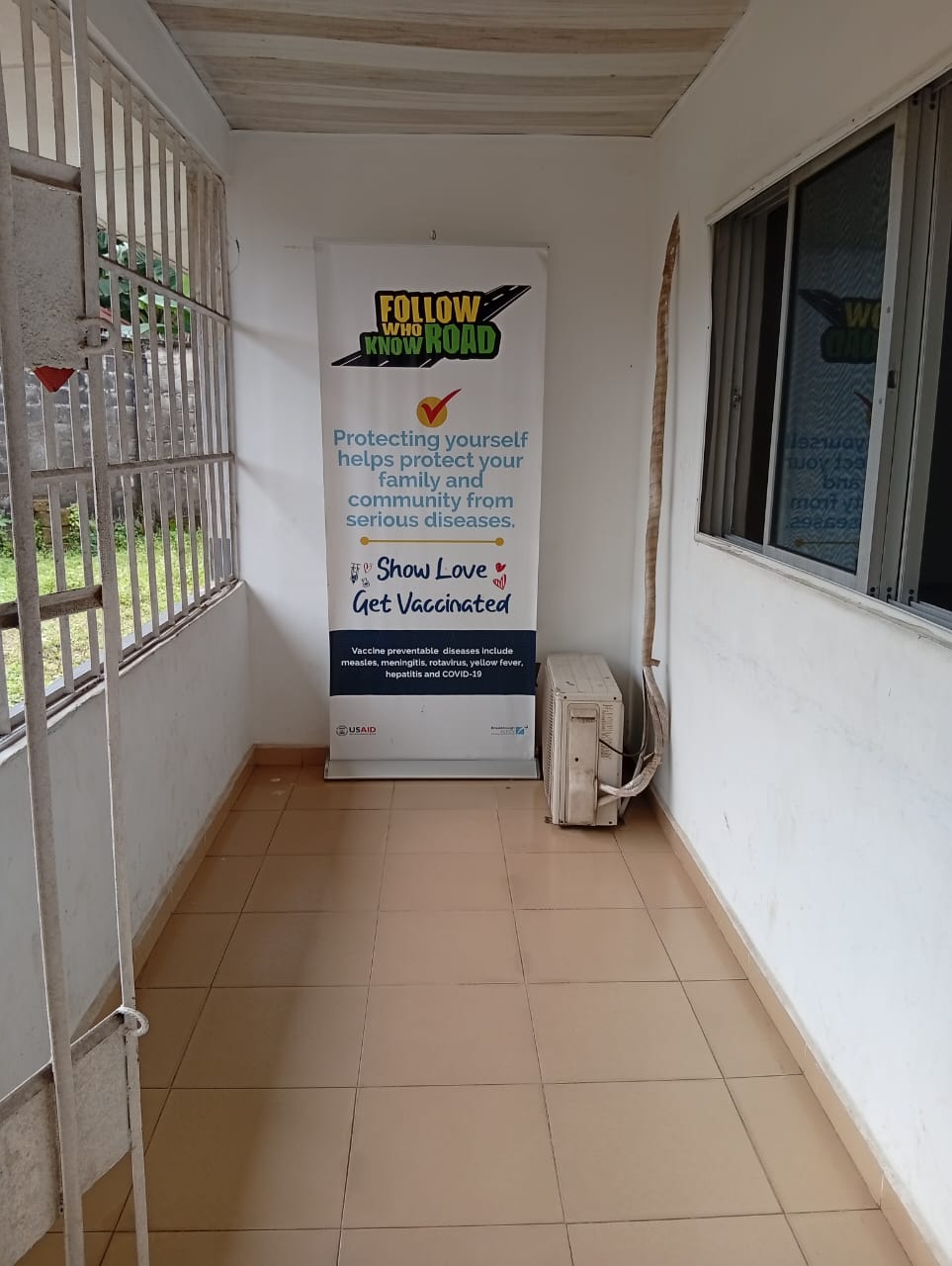 Clean covered corridor and vaccination information at St. Mathias Health Services
